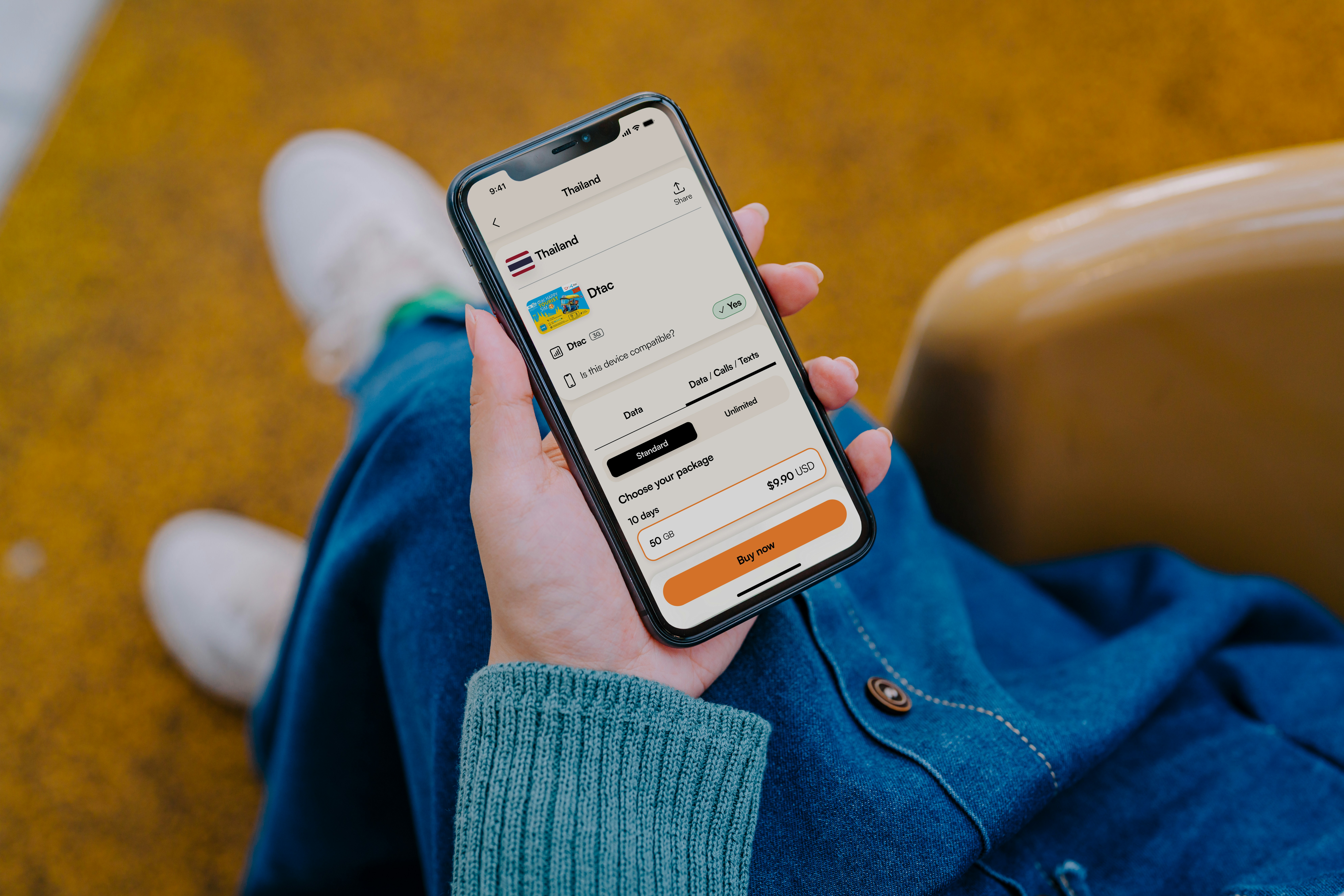 Traveler using a phone while planning a trip